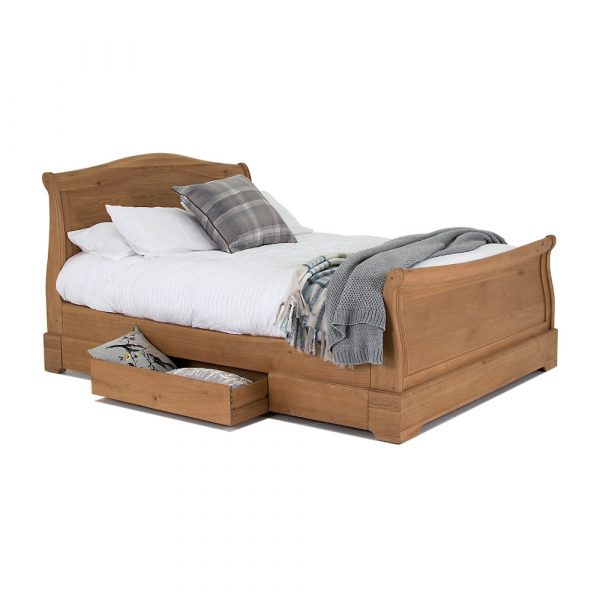 Solid wood bedframe with storage drawer on a white background Des Kelly