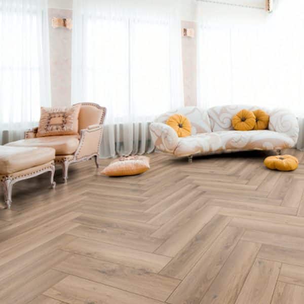 Metz herringbone wood floor with sofas in the background
