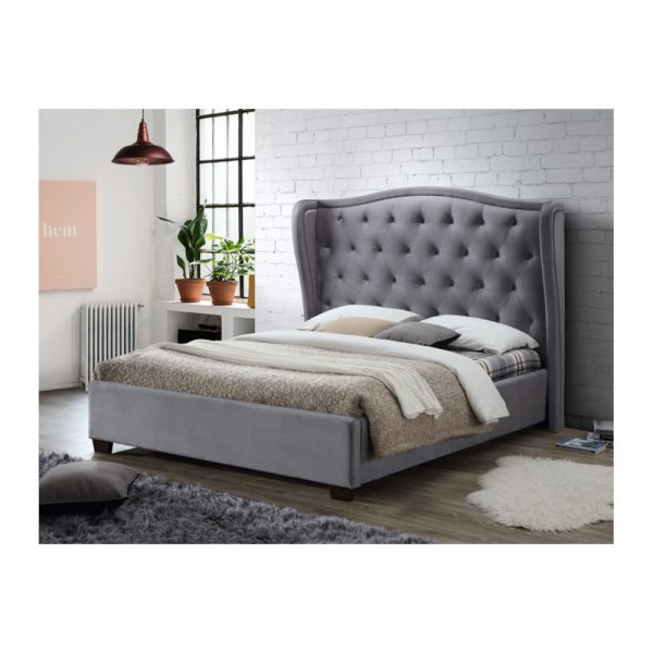 Grey nora bedframe with headboard in the middle of a bedroom
