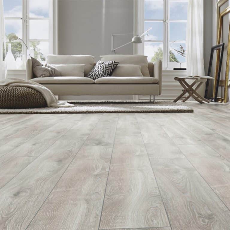 Long oak silver wooden flooring with a stylish couch on top
