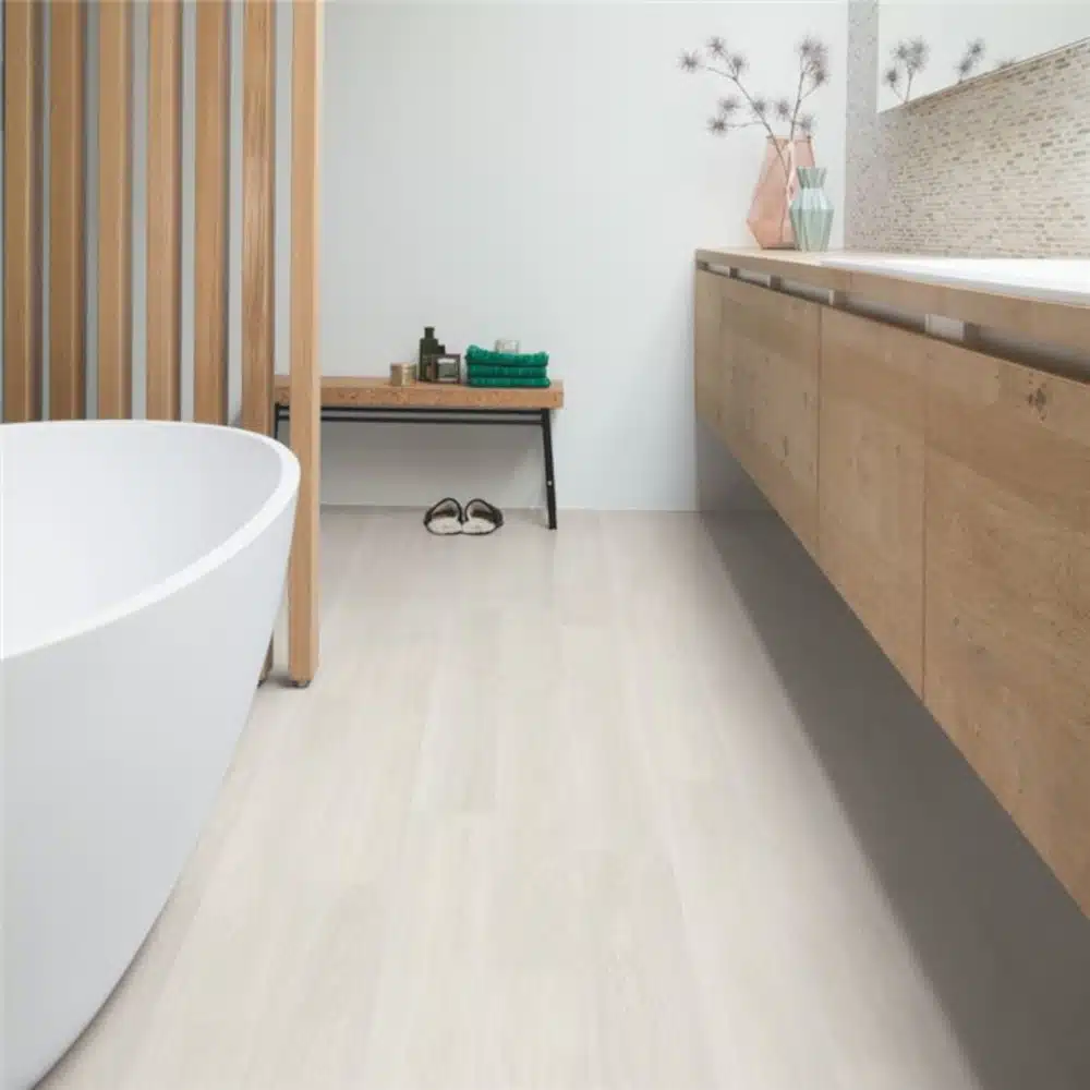 Quickstep light oak grey wood flooring in a bathroom