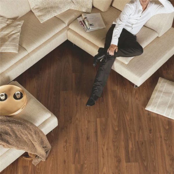 Quickstep oiled walnut hardwood floor with a sofa on top