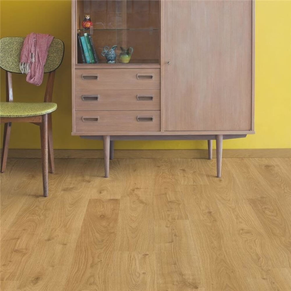 Eligna light oak wood floor with a chest of drawer in the back