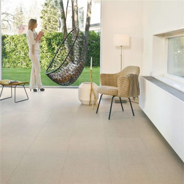 Quickstep crafted textile flooring with a small armchair