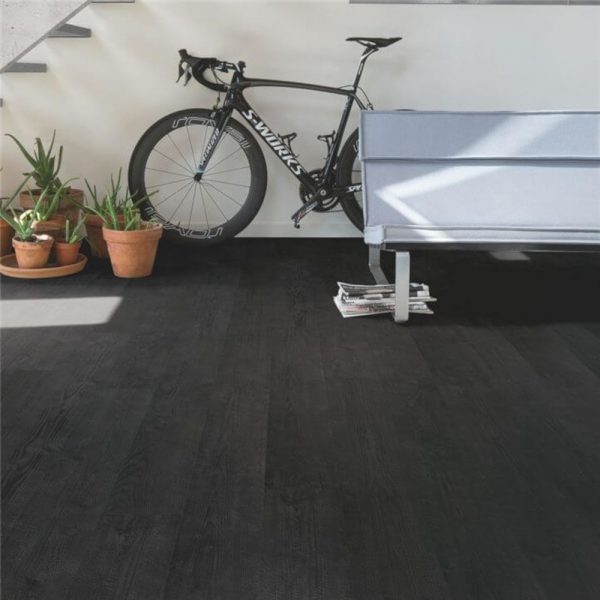 Burned planks quickstep floor boards and a bike