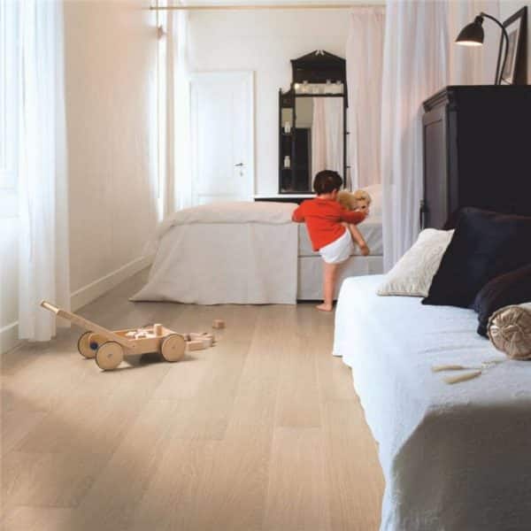 solid white wood flooring with kids bedframes in the back