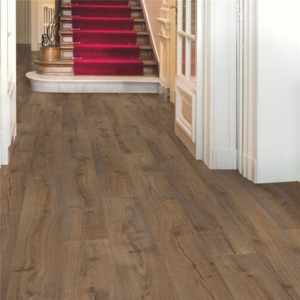 Quickstep dark oak wood floors with stair carpet in the background