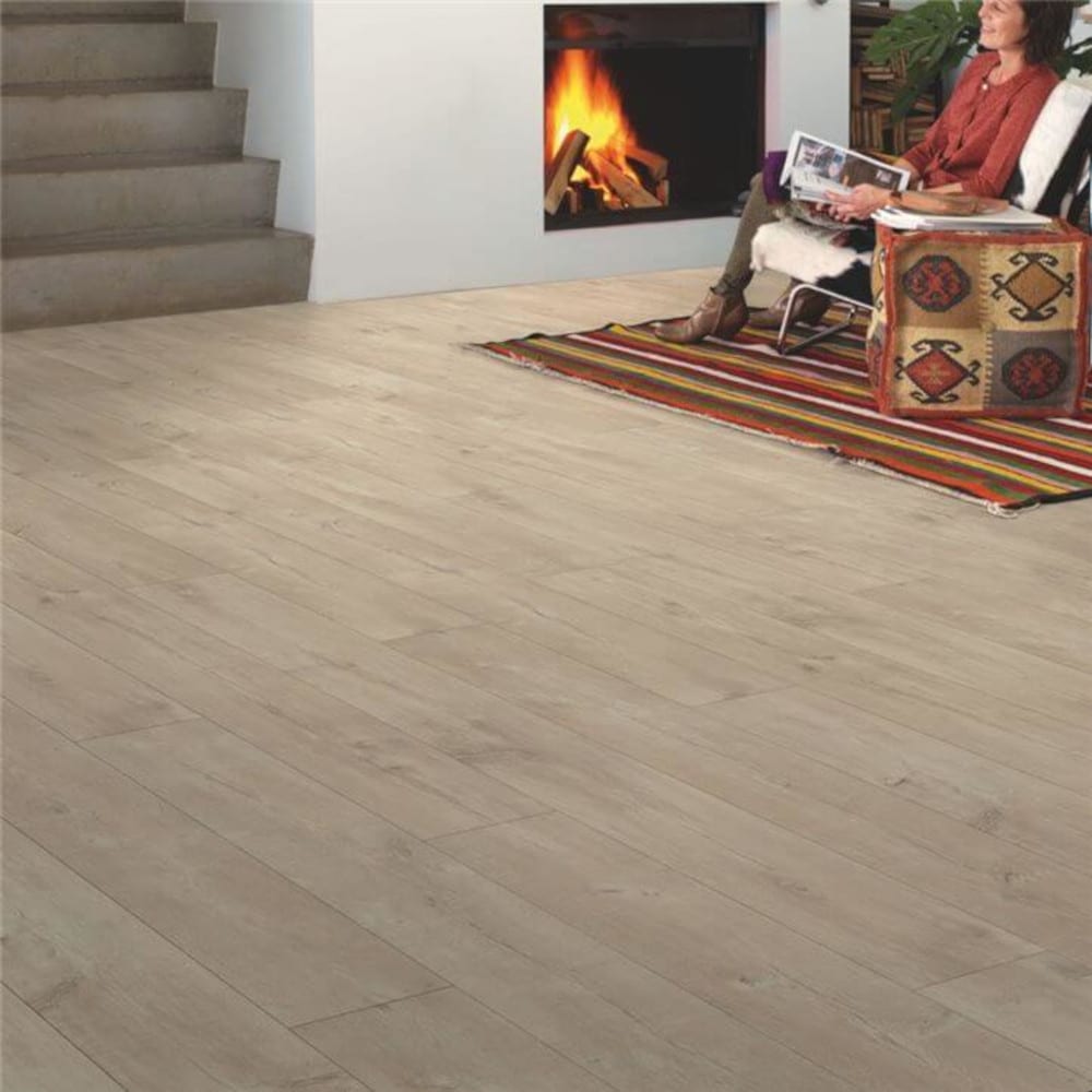 Dominicano quickstep wood flooring with a rug on top