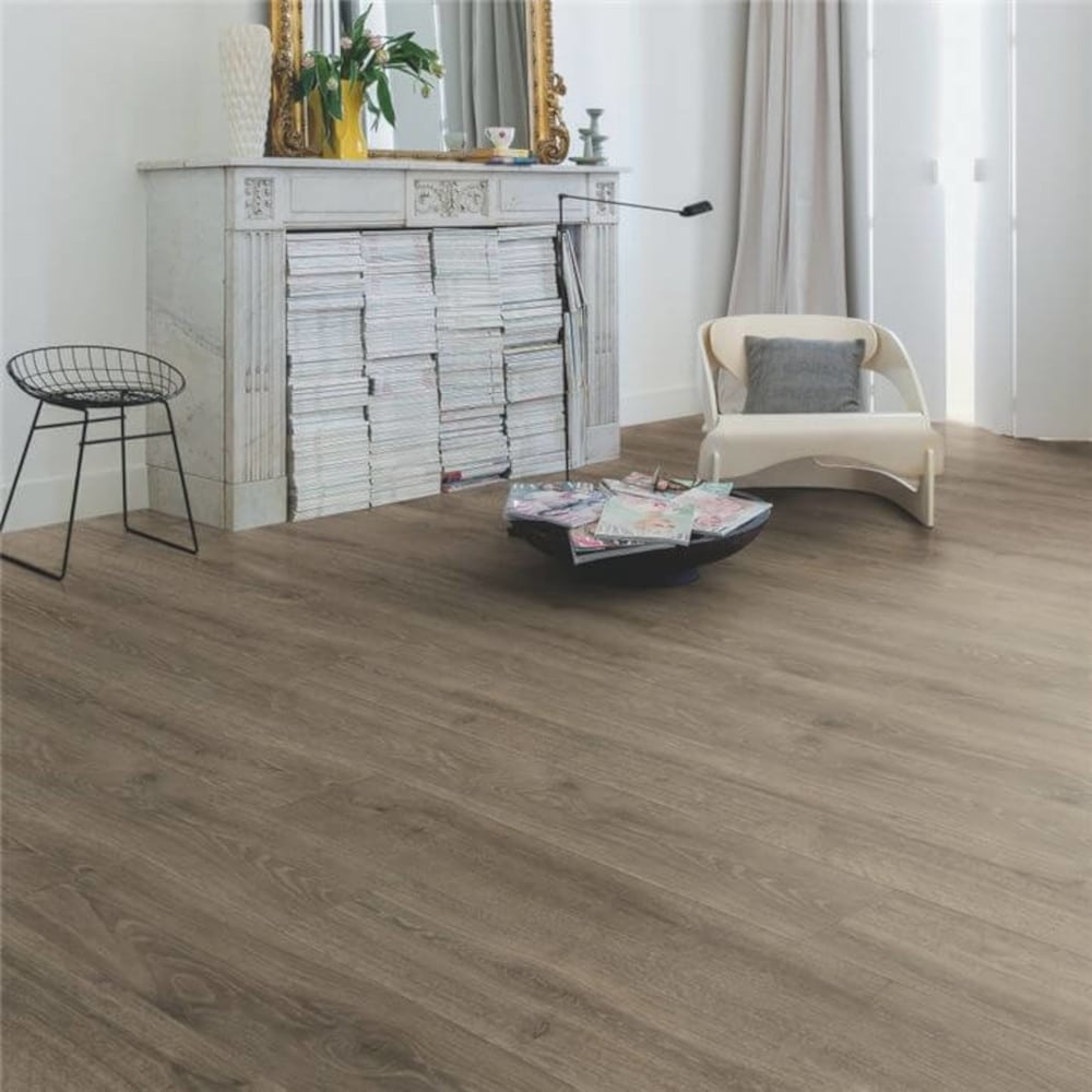 Quickstep solid oak woodland flooring with a stool on top