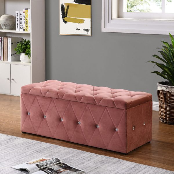 Pink ottoman blanket box with diamonds in a living room