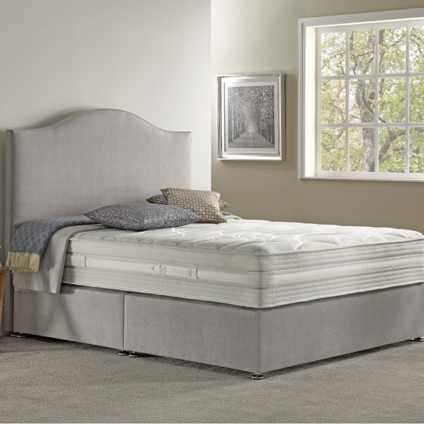 Sapphire bed set with mattress in the middle of a bedroom
