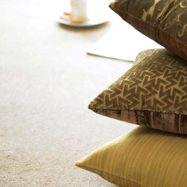 Burford twist carpet and a pile of pillows