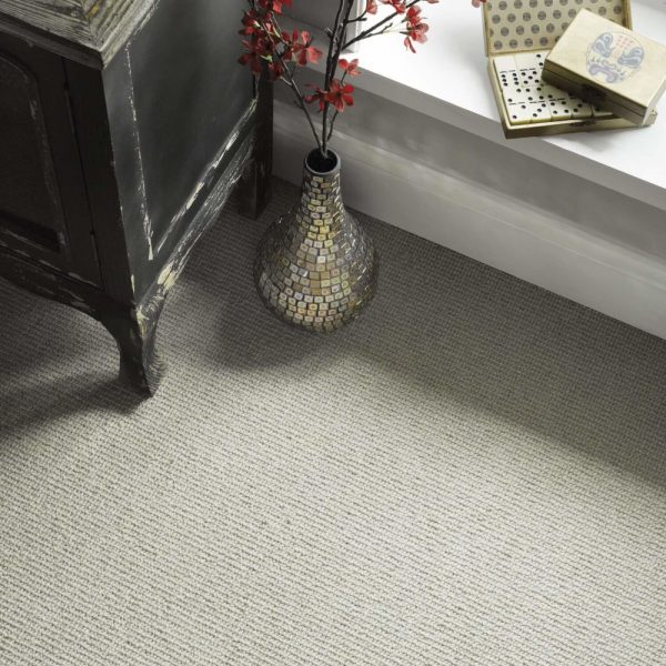 Sisal weave carpet with a console table on top