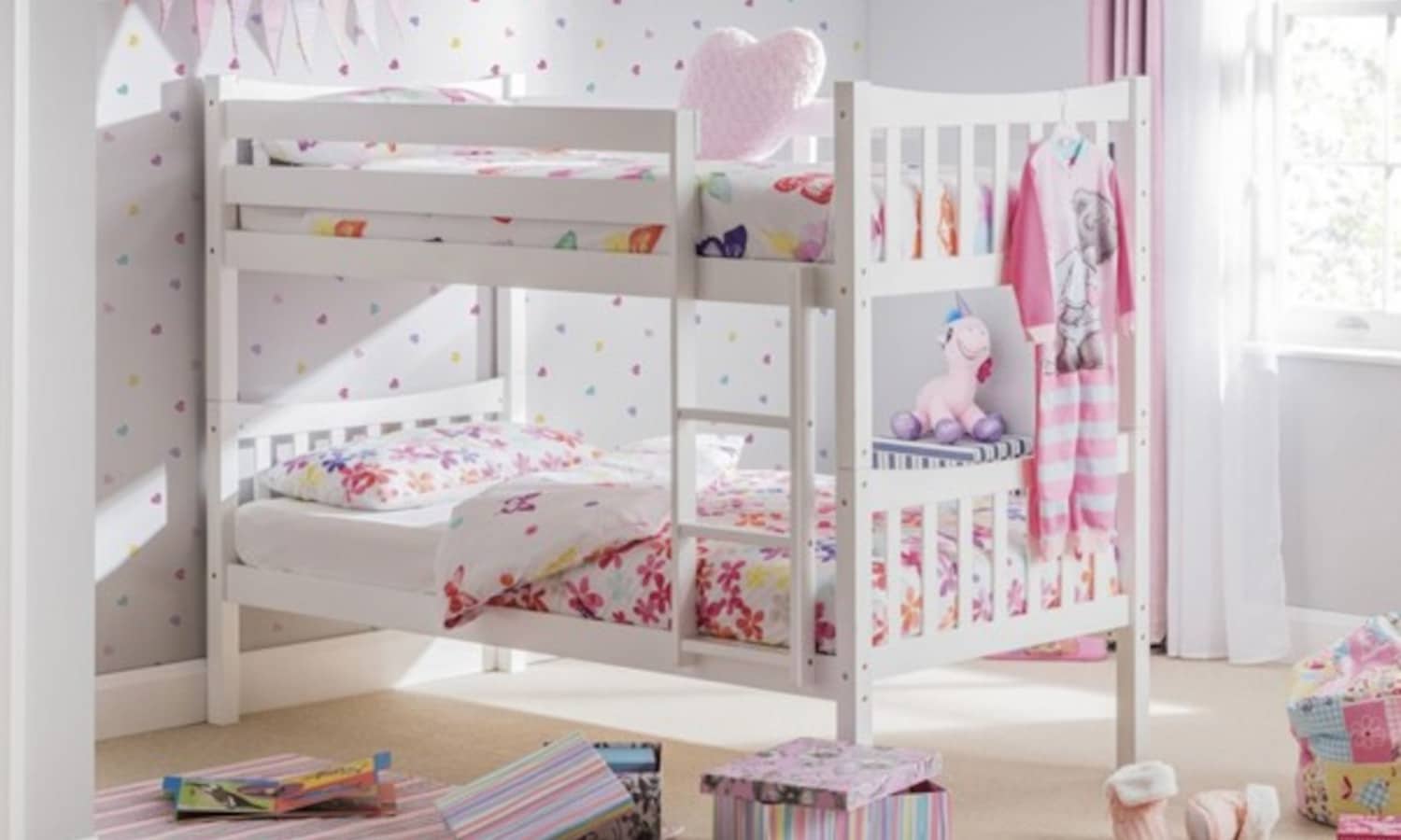White bunk bed in a girl's bedroom