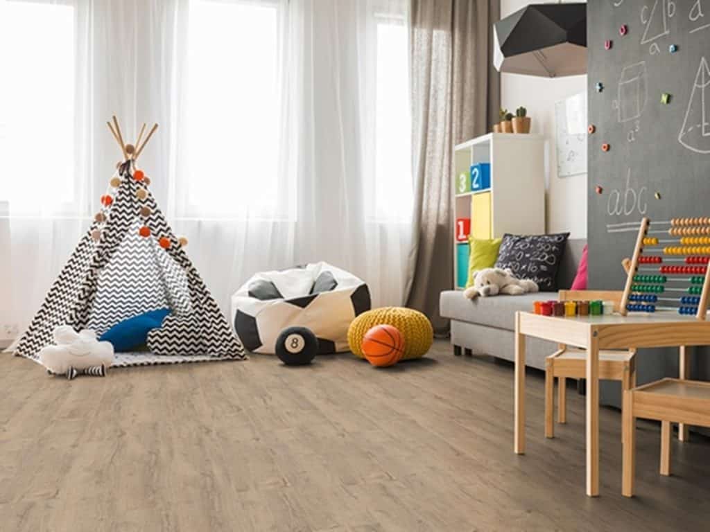 Hardwood flooring in a child's bedroom with toys on top