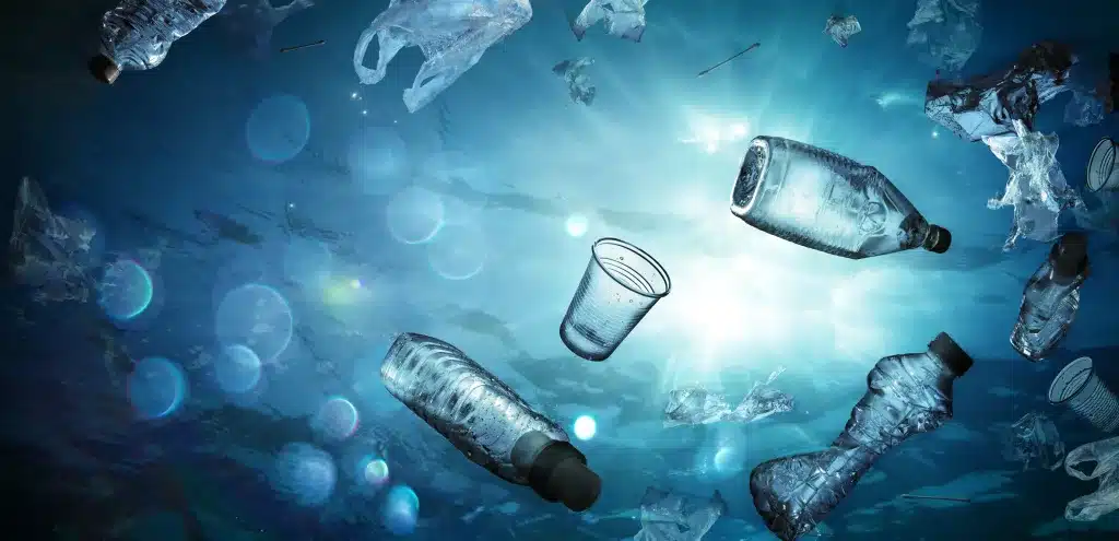 Plastic Pollution In Ocean Underwater Shine With garbage Floating On Sea Environmental Problem